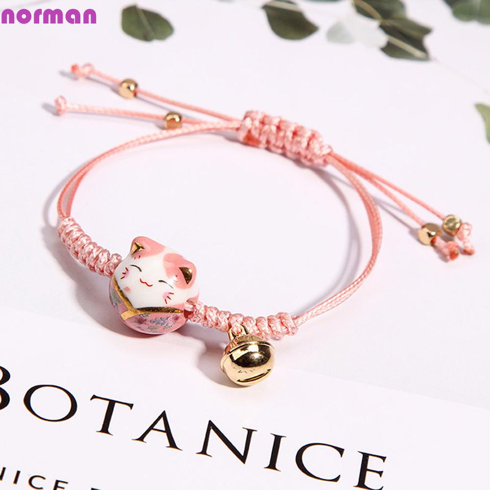 Vòng Tay Bện Dây Đỏ May Mắn Đính Chuông Gốm Sứ Hình Mèo May Mắn Dành Cho Nữ