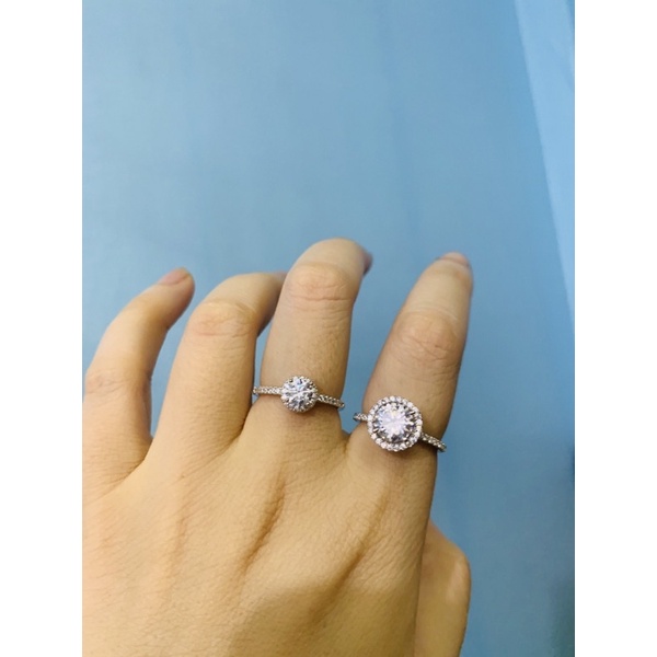 Nhẫn nhỏ 1 hàng đá ôm 1 viên chủ 4-5ly bạc thật phủ vàng trắng