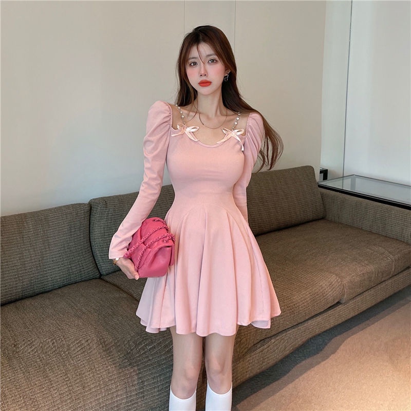 Long sleeved dress women's autumn decoration body temperament short skirt with thin waist and bow design sense, small and fluffy skirt