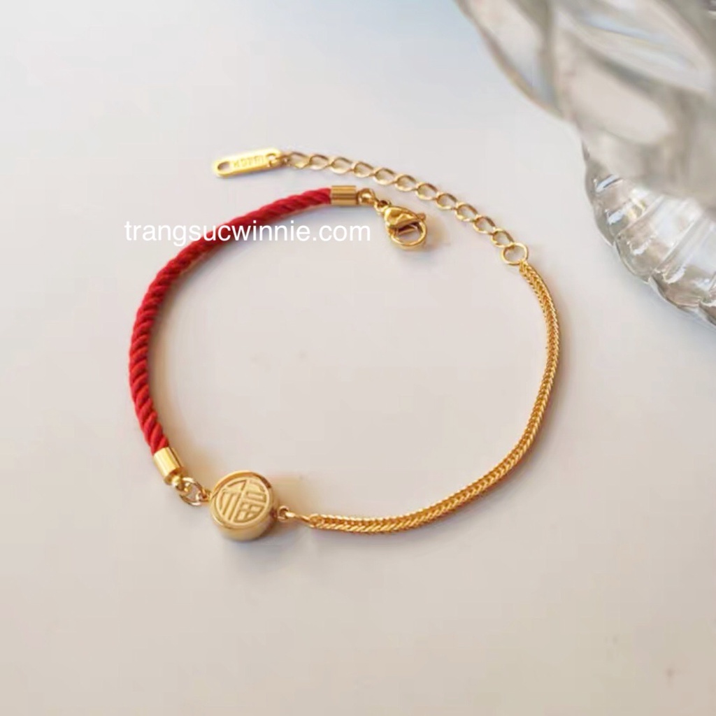 Lắc tay nữ titan Hồng Phúc