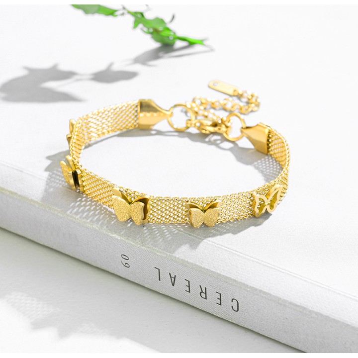 Lắc tay (vòng tay) titan cánh vàng