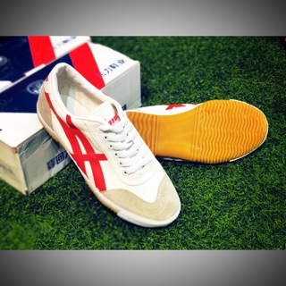 Giày BĐ siêu phủi Warior trắng sọc đỏ ( nội địa TQ)