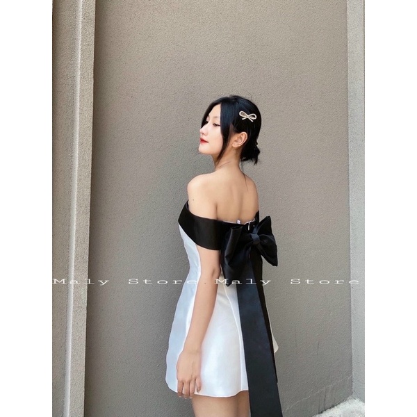 Đầm xoè nơ lưng trễ vai đen hồng xanh trắng