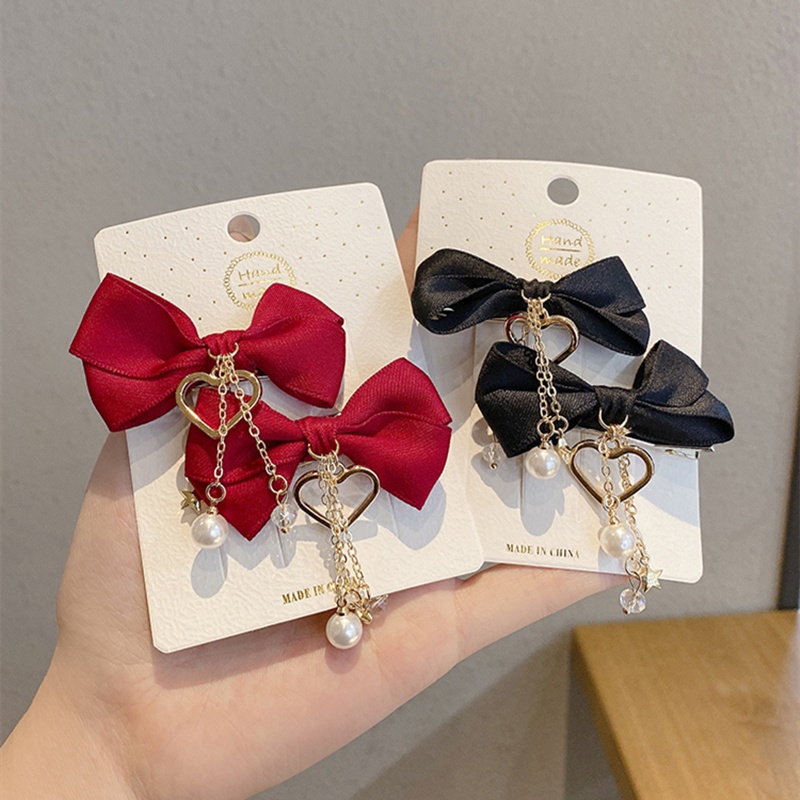 ✨✨Set 2 Kẹp Tóc Nơ Tua Rua Đính Ngọc Trai Giả Mừng Năm Mới