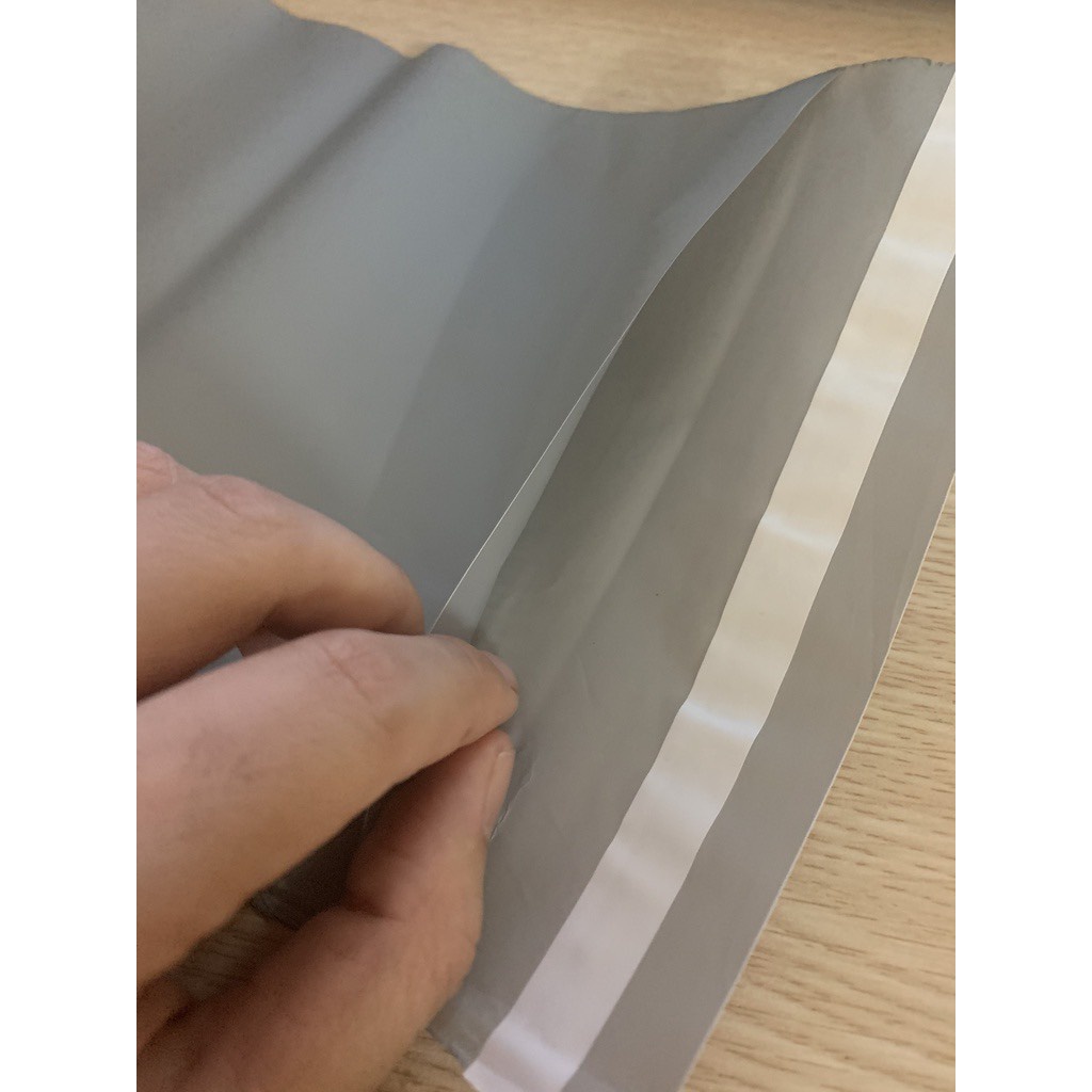 Túi gói hàng niêm phong dán miệng có sẵn keo, túi đóng hàng online size 25x25 cuộn 100 cái
