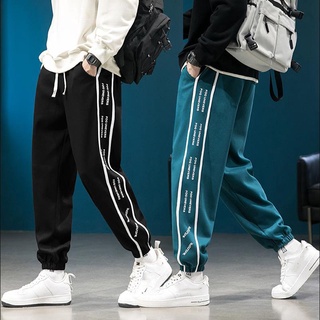 Quần thun nam nữ unisex phối kẻ sọc chữ hai bên bo gấu vibe thời trang zizi
