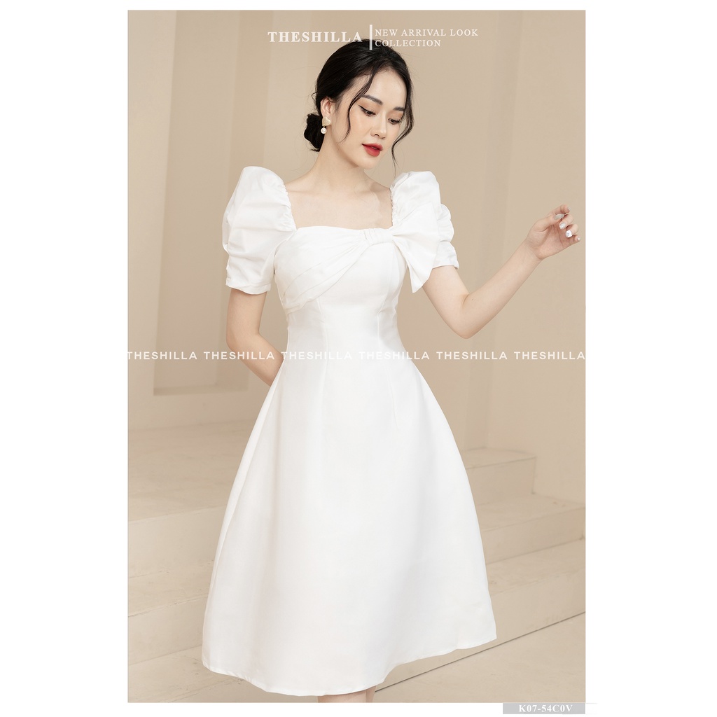 Váy thiết kế cao cấp màu trắng tay phồng xoắn nơ ngực form dài sang trọng  The Shilla - K07-54C0