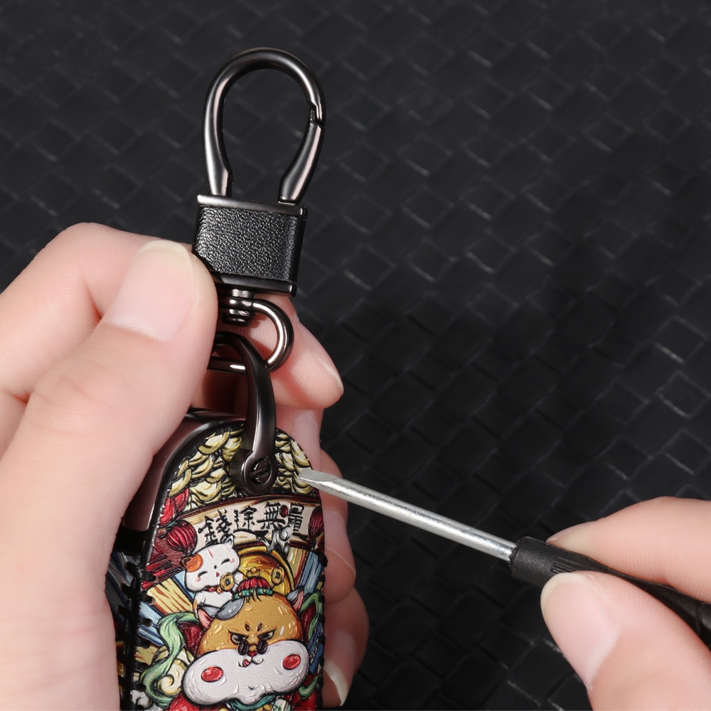 Móc chìa khóa xoay 360 độ bằng da chống thất lạc tiện dụng