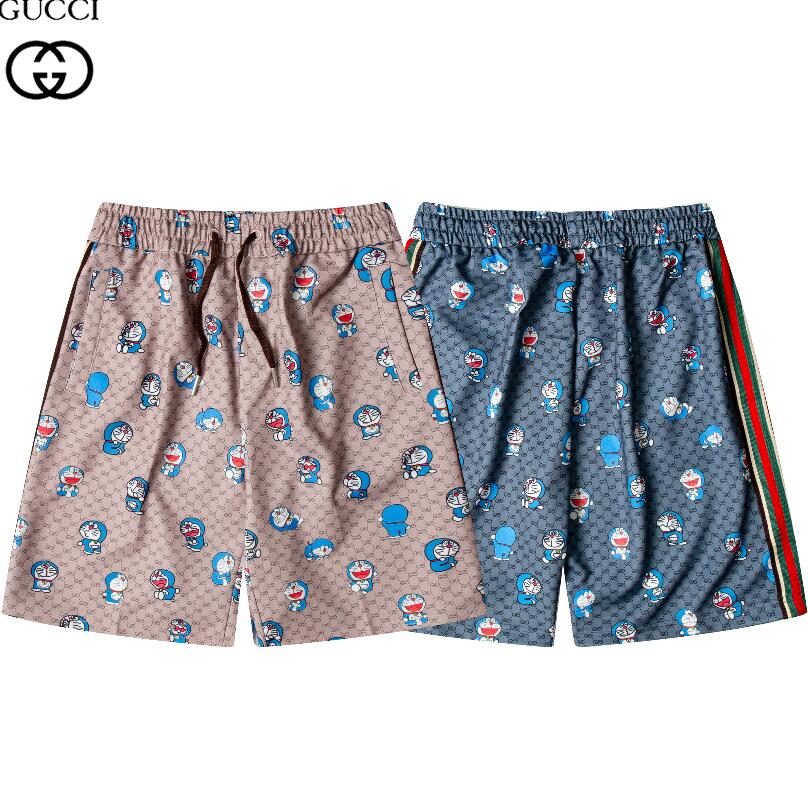 Quần Short Đi Biển Vải Cotton In Hình Doraemon Dễ Thương Cho Nam + Nữ