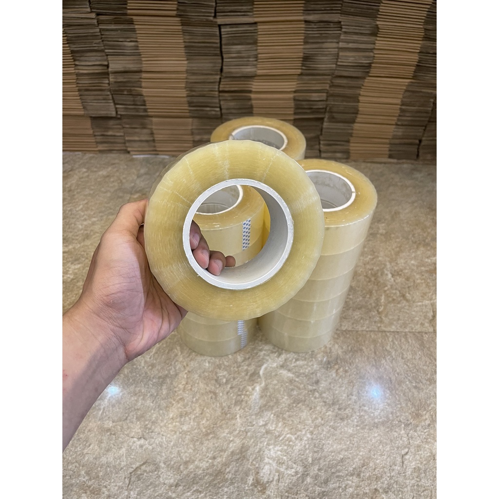 Băng dính màu trắng trong 0,5kg dùng gói hàng COD lõi siêu mỏng - 1 cuộn