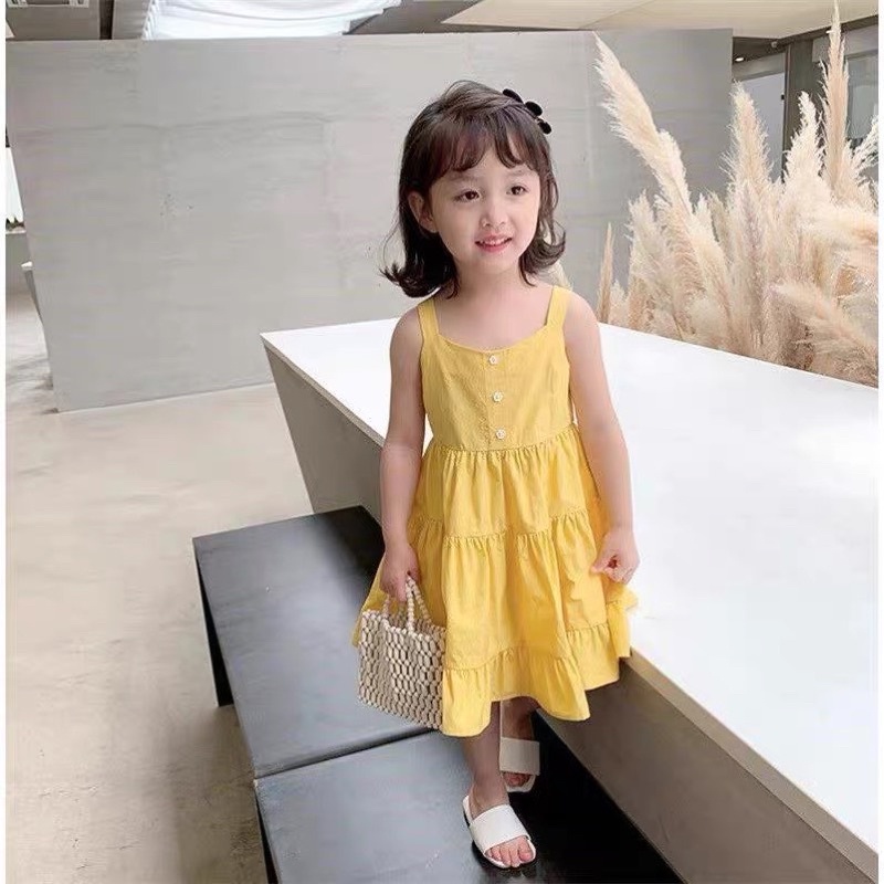 Váy vàng cam xoè tầng cho bé gái