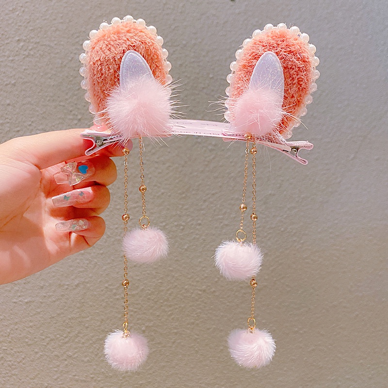 Kẹp tóc hình tai thỏ phối tua rua xinh xắn cho bé gái