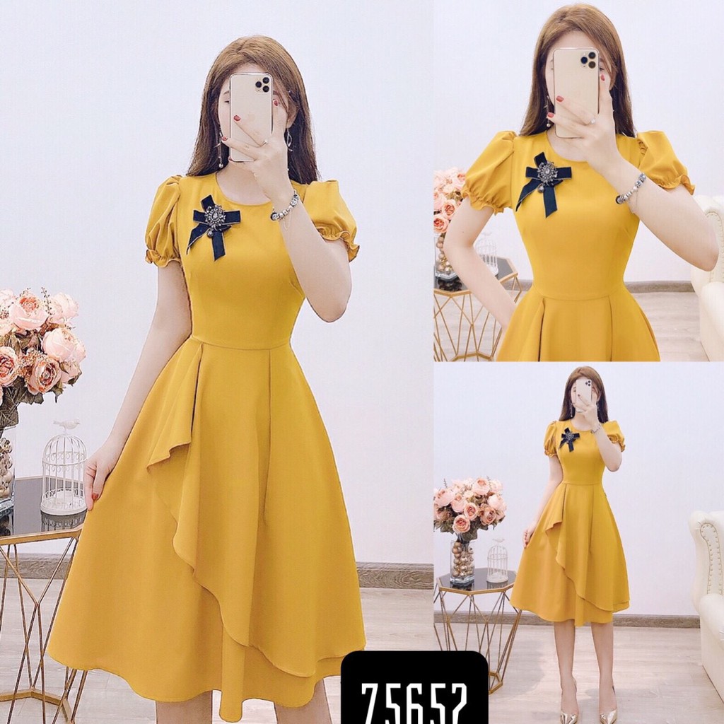Đầm xòe vạt xéo tay phồng kèm hoa cài áo