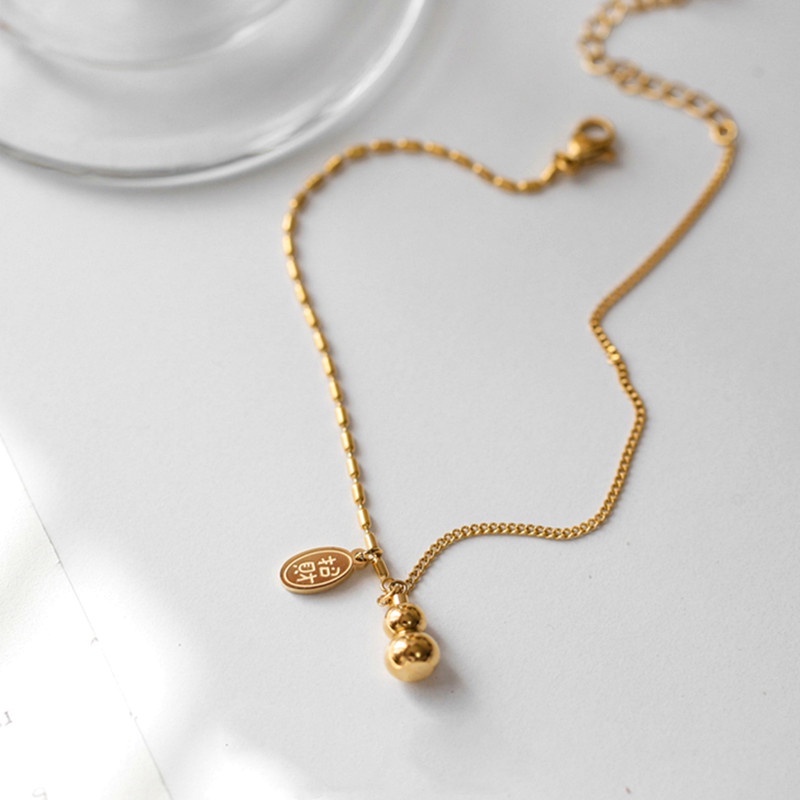 Lắc chân Titan chống gỉ màu vàng 18k mặt hình quả bầu sang trọng cho nữ