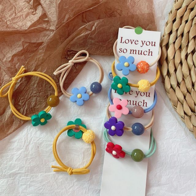 Dây buộc tóc một bông hoa + một viên đá sắc màu