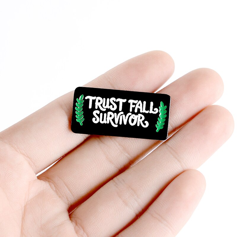 Ghim Cài Áo Tráng Men Hình Chữ Trust FALL SURVIVOR Màu Đen