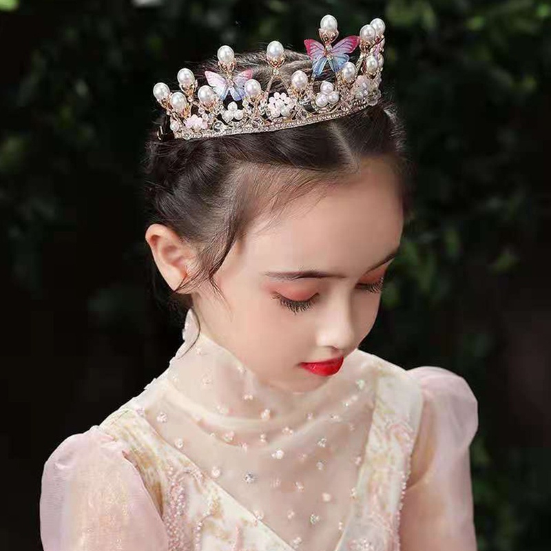 Vương miện đính ngọc trai và pha lê hình bướm dùng để hóa trang biểu diễn