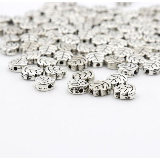 Bộ 50 Hạt Charm Hình Lá 7mm Bằng Kim Loại Màu Bạc Tây Tạng Dùng Làm Trang Sức DIY