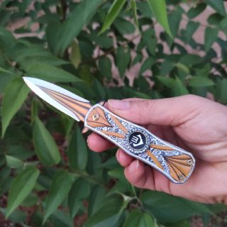 Dao gấp spinner xoay 360