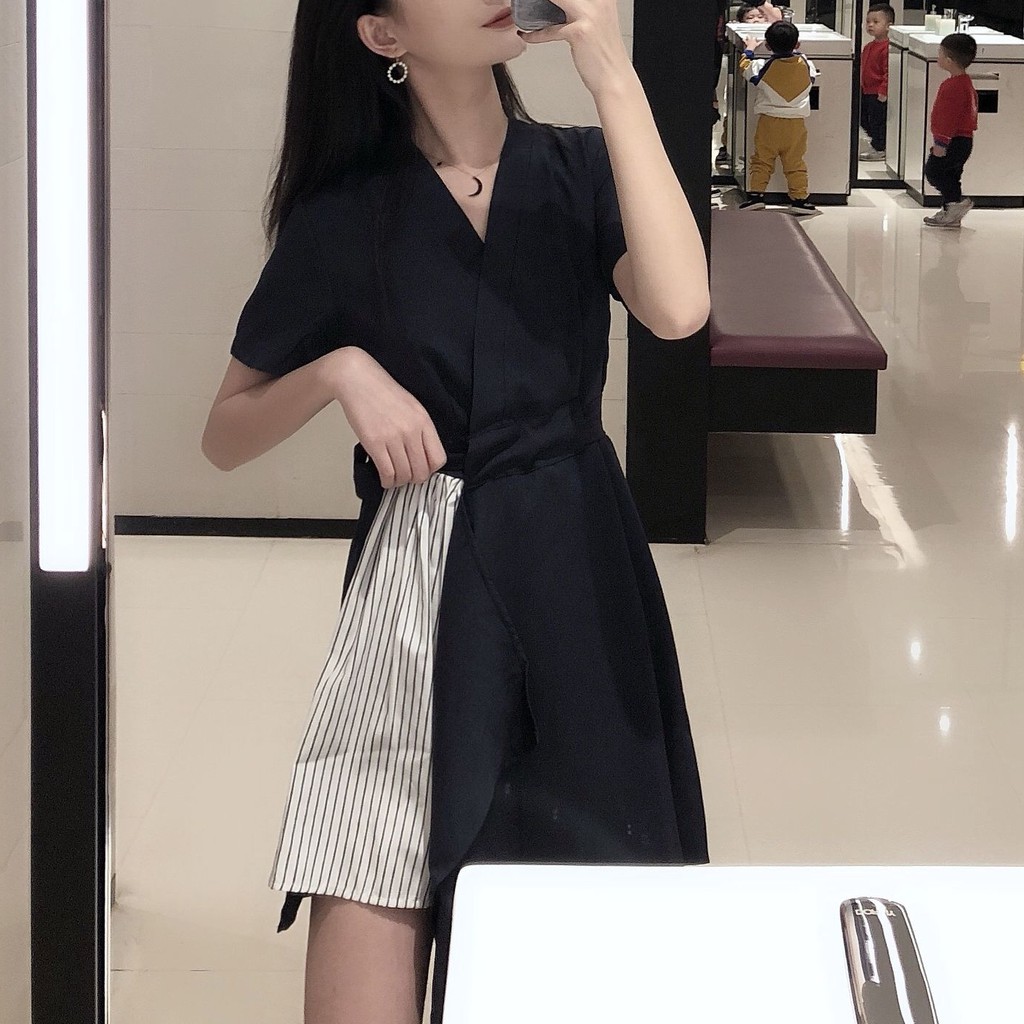 Women's office dress with short sleeves and black skirt