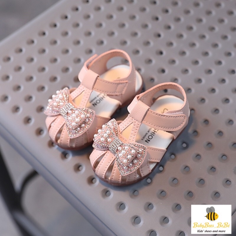 Sandal quai rọ tập đi cho bé gái, dép quai hậu đính nơ có kim sa lấp lánh cho bé từ 0 đến 4 tuổi, 2 màu trắng - hồng a10