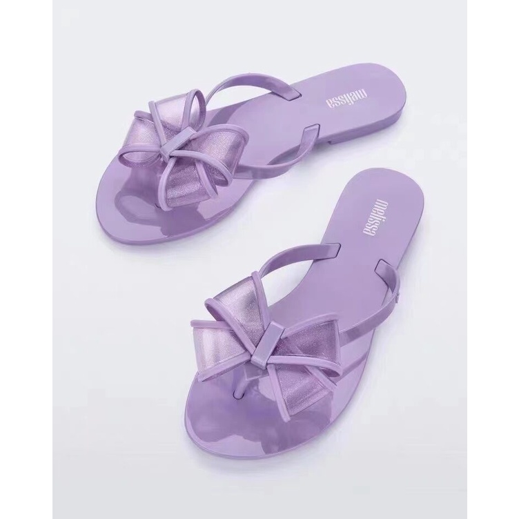 Dép Xỏ Ngón Đi Biển Đế Phẳng Đính Nơ Phong Cách Melissa Mẫu Mới 2022