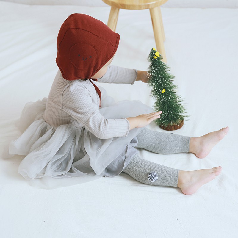 Quần legging vải cotton mềm mại đính quả bông lông nhung màu trơn đáng yêu dành cho bé gái