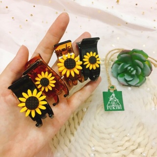 Kẹp càng cua hoa hướng dương ảnh thật