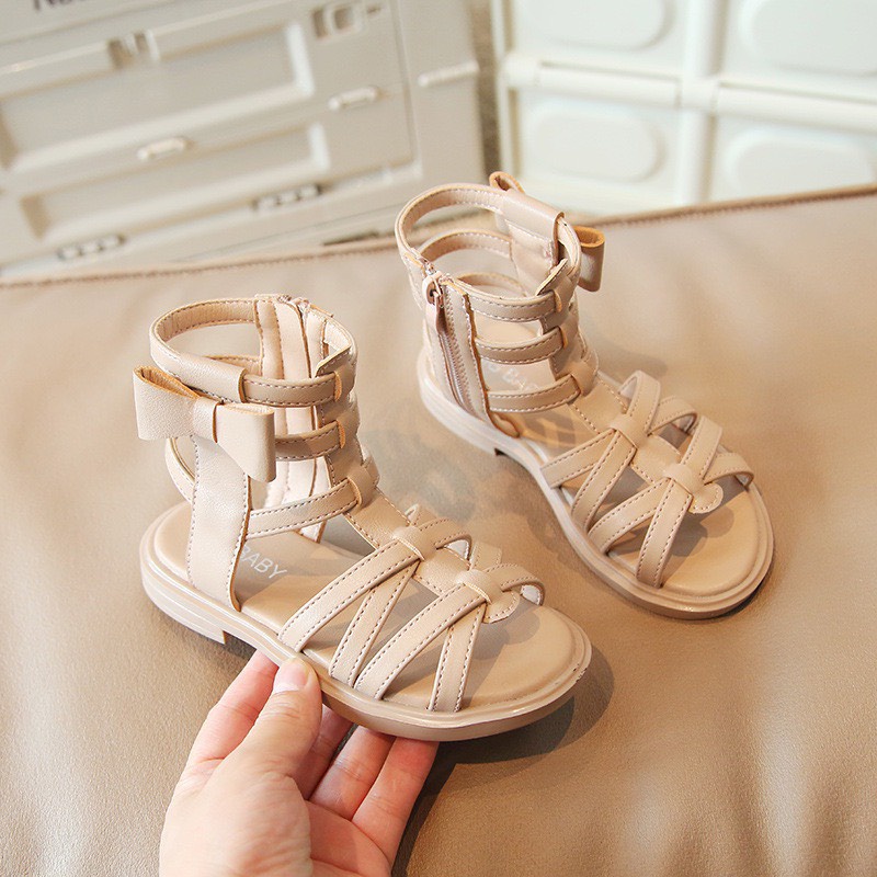 Sandal chiến binh đính nơ ở cạnh cho bé gái - Dép cao cổ có quai đan chéo, đế mềm êm chân chống trượt cho bé