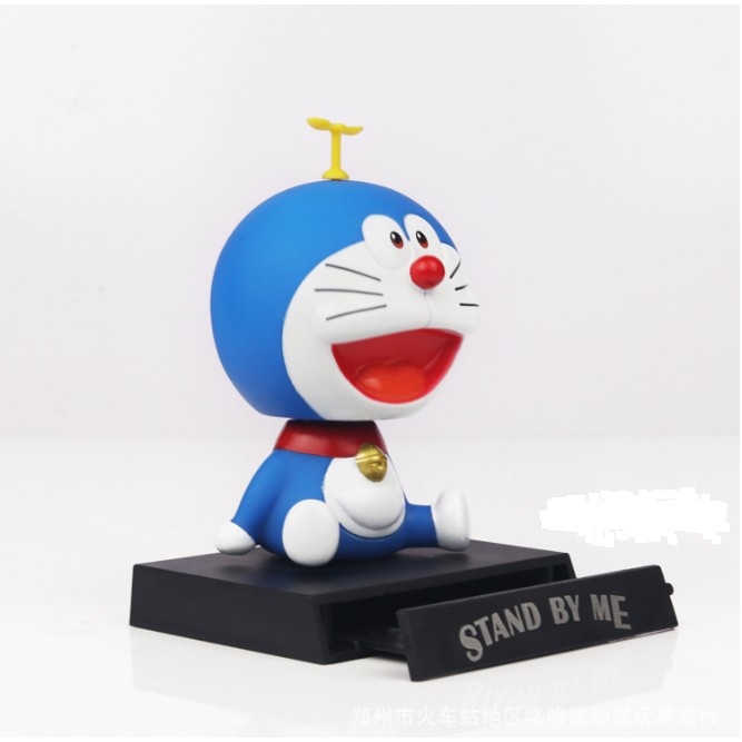 Búp bê Doraemon đầu gật gù để trang trí bàn học, táp lô xe hơi