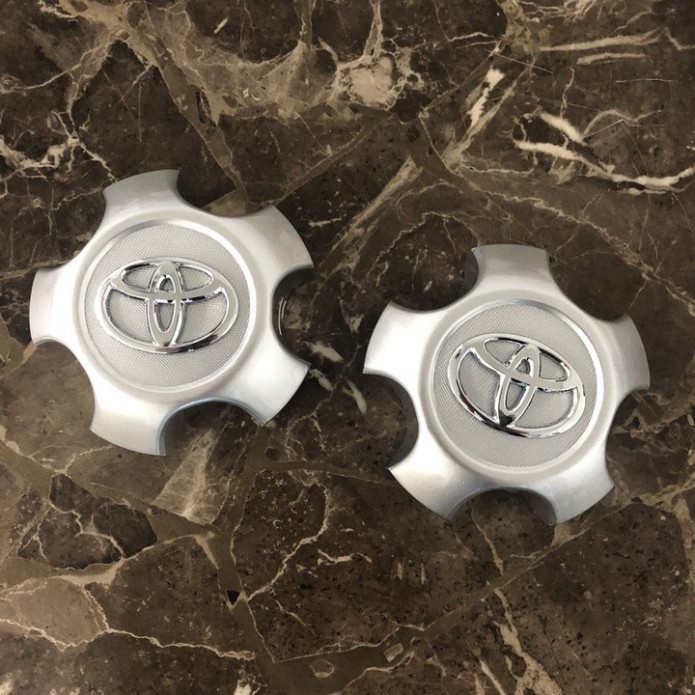 Sản Phẩm Logo chụp mâm, ốp lazang bánh xe ô tô Toyota RAV4 2009-2013 TY-030 .