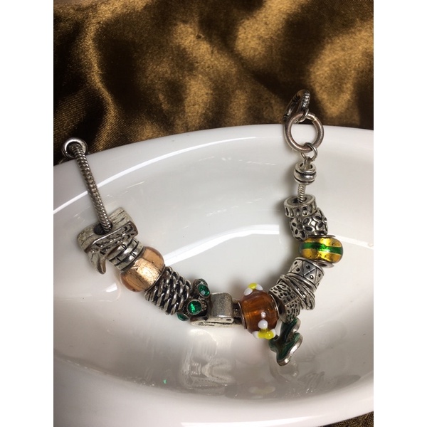 Lắc tay charm vintage-chốt cài then mu ra no