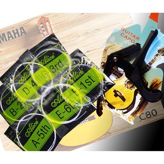 combo 2 món: 1 bộ dấy Guitar classic - dây nilon( gồm 6 dây) và 1 kẹp capo