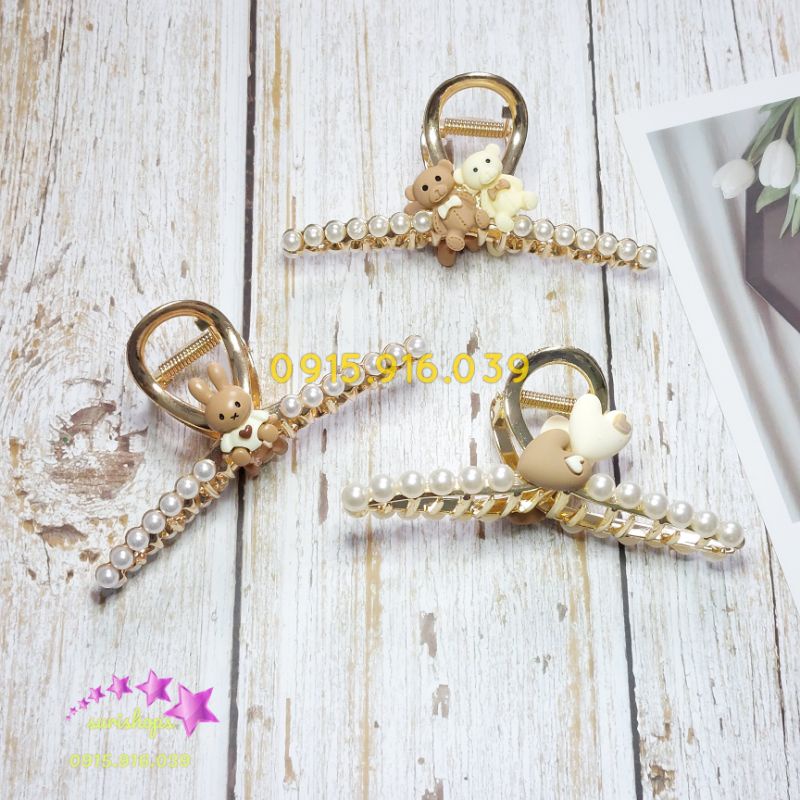 Kẹp tóc dạng T chéo kim loại màu vàng