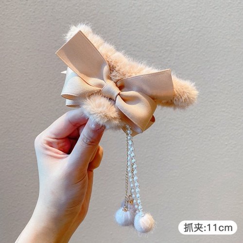 Kẹp gấp tóc nhung nơ tua rua