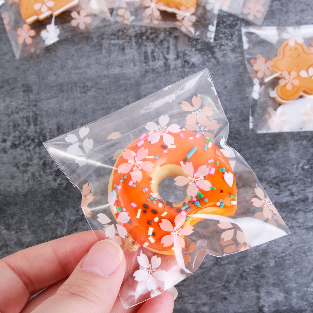 Set 100 túi nhựa dán đựng kẹo in hoa xinh xắn