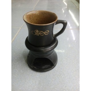 Cốc và bếp hâm nóng cafe