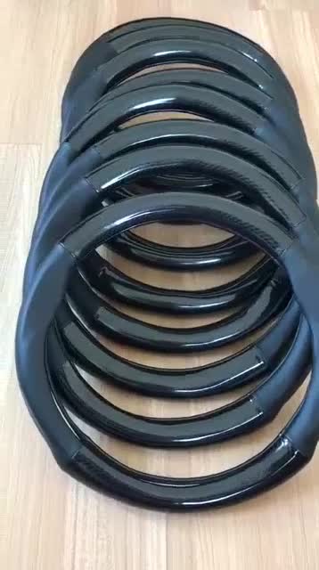 Bọc vô lăng da carbon logo KIA