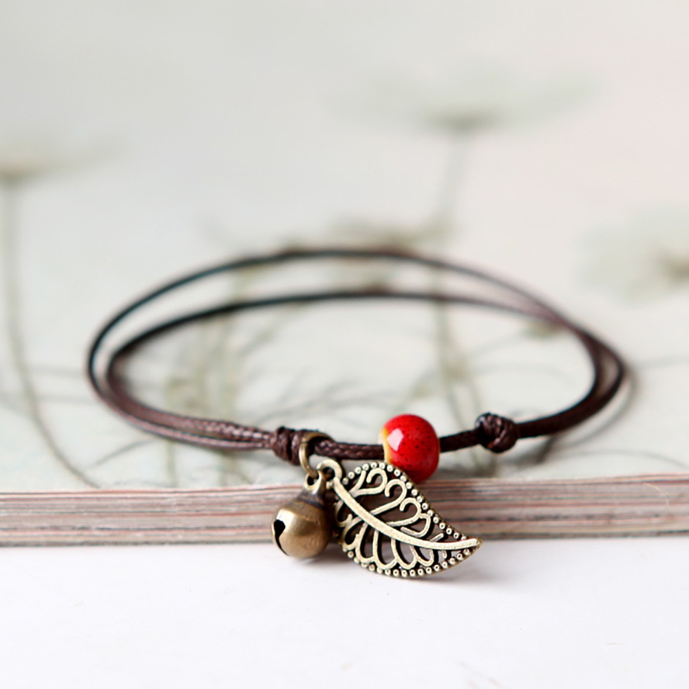 Vòng tay dây đan họa tiết chiếc lá có đính chuông nhỏ cá tính
