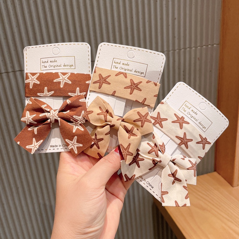 Kẹp tóc bb dáng vuông và nơ buộc làm từ vải họa tiết sao biển bắt mắt