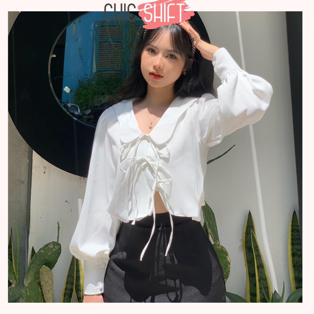 Áo sơmi nữ dài tay cột nơ cách điệu màu đen và trắng vạt áo lượn sóng mặc đi học, đi chơi - Chicshift
