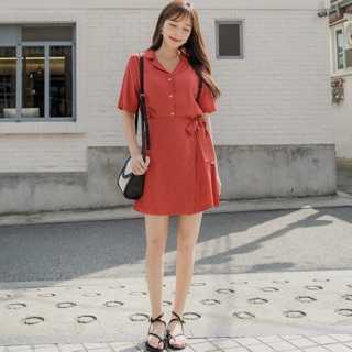 Đầm sơ mi cam đắp tà