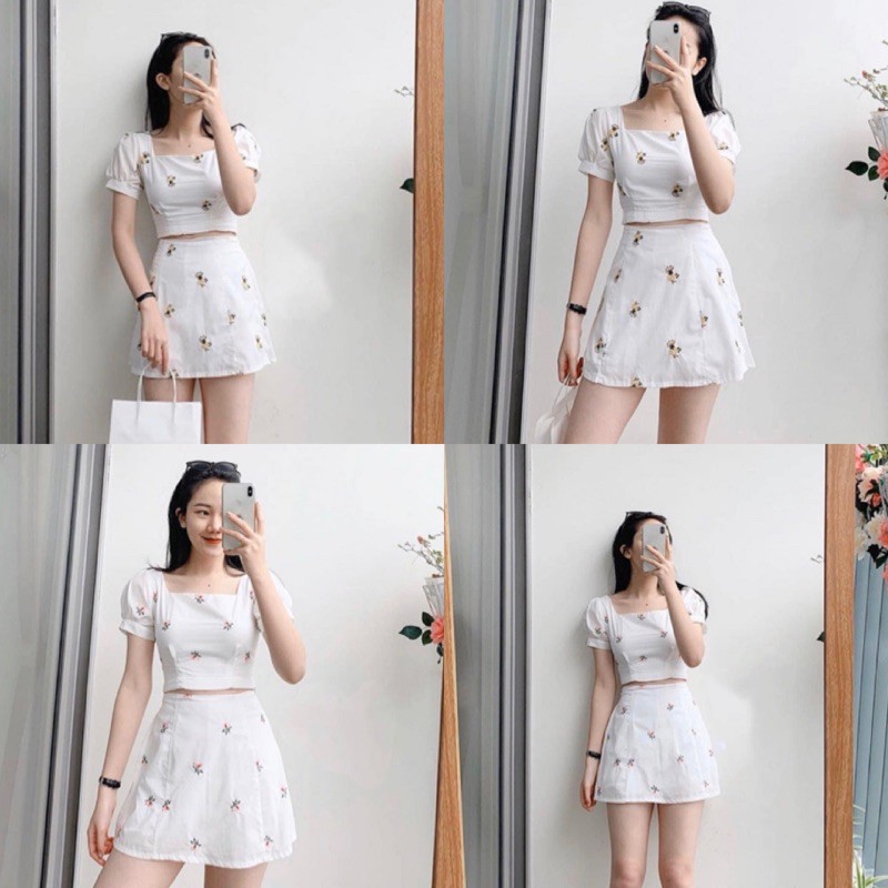 Set đồ gồm chân váy ngắn và áo croptop tay phồng hoạ tiết hoa nhí