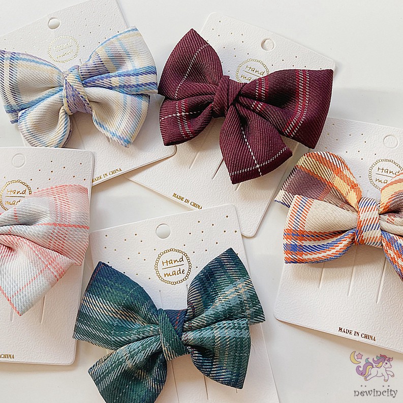 Kẹp tóc đính nơ kẻ sọc ca rô xinh xắn dành cho bé gái