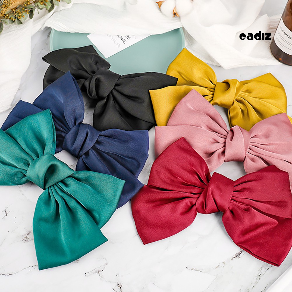 Kẹp tóc nơ màu trơn xinh xắn đáng yêu