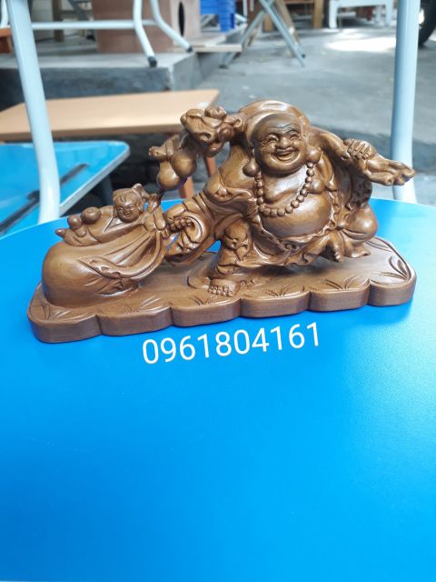 Di lặc kéo bao - phật di lặc kéo bao tiền - gỗ bách xanh thơm dịu