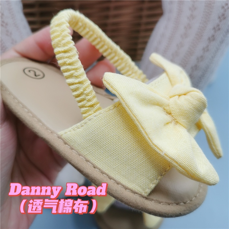 Giày sandal tập đi đính nơ chất liệu vải chống trượt xinh xắn thời trang mùa hè dành cho bé gái sơ sinh