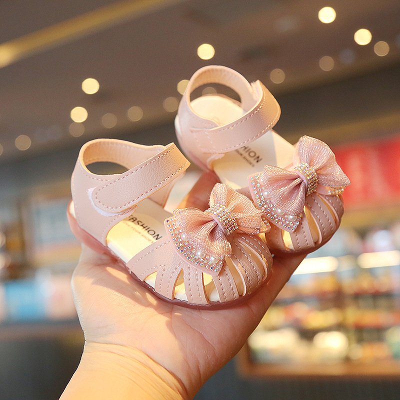 Dép rọ, sandal tập đi cho bé gái từ 0 đến 2 tuổi đính nơ ren đá xinh xắn đế mềm chống trơn mã A9