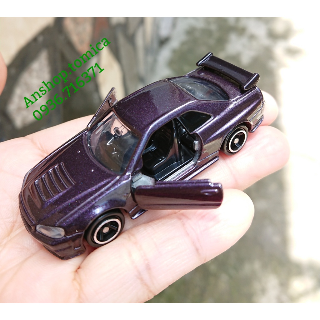 Mô hình xe N i s m o màu tím than mở được cửa tomica Nhật Bản