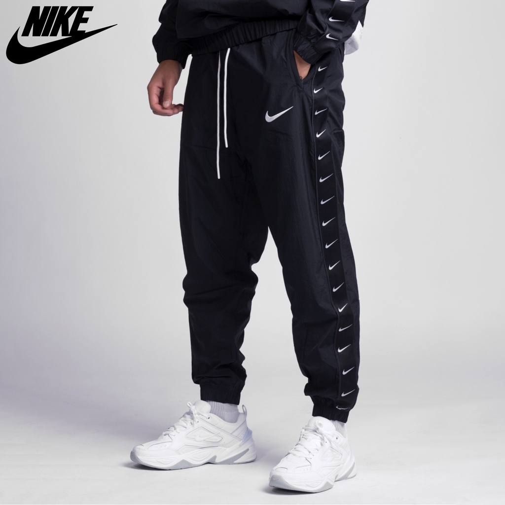 NIKE - Quần dài thể thao nam nữ Nike Taped Swoosh Woven Trousers chính hãng - Đen